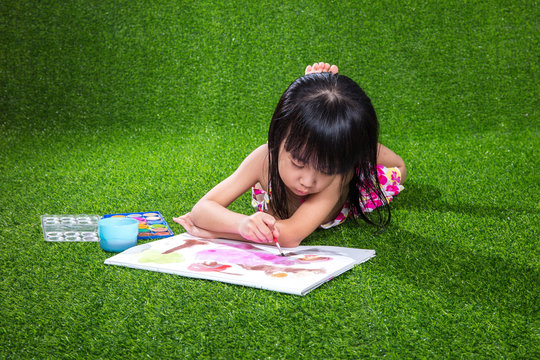 Asian Chinese little girl drawing and painting