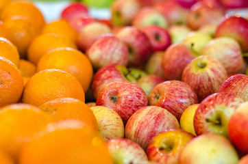 beautiful color combination, orange and red apple background display at market stall.