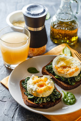 Healthy sandwich with spinach and poached eggs