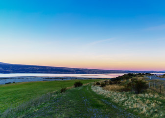 Beautiful sweet colour Pukaki lake in twilight at dusk , Mackenzie District, Canterbury , South Island of New Zealand