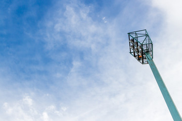 A cloudy sky background image that features a light tower. 