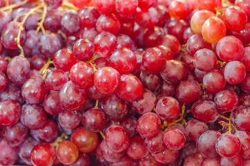 Bunch of raw grape display at fresh market.