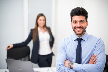 Portrait of a smiling businessman in his office