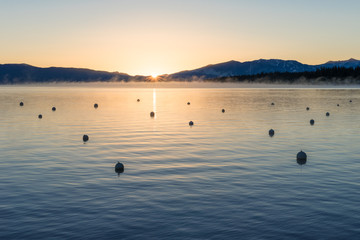 Sunrise over tranquil mountain lake
