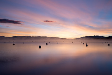 Obraz na płótnie Canvas Sunrise over tranquil mountain lake