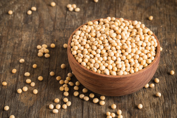 Soybeans in a wooden bowl On the old wood table