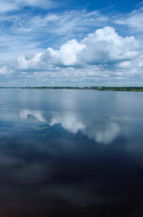 The cloud is reflected in the water