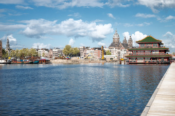 Fototapeta na wymiar Panoramic view of urban and historical houses on the Amsterdam, famous touristic city, Netherlands