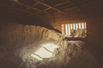 Salt deposited in a dirt built house at Maras salt ponds in Peru's Sacred Valley.