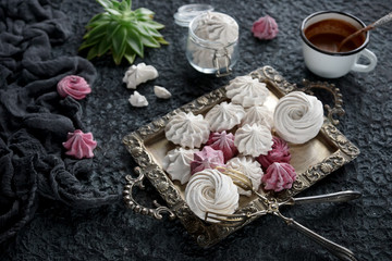 vanilla and raspberry homemade zephyr and cacao mug on dark stone background. sweet delicious marshmallows,  selective focus