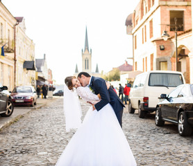 Fototapeta premium Beautiful wedding couple. They kiss and hug each other