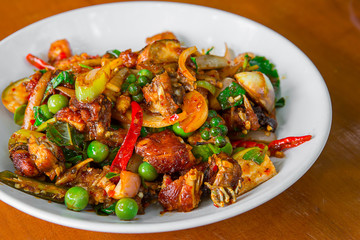 Stir-fried frog and basil on wooden Amazing Thailand spicy food