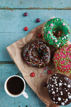 delicious homemade donuts on  rustic turquoise  wooden background. Delicious breakfast, top view, selective focus
