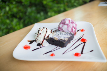 Homemade brownies with vanilla ice cream and whipped cream