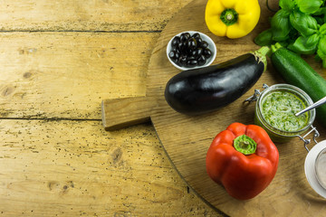 Peppers and zucchini with herbs salad on cutting board