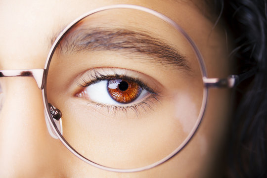 Image of a beautiful young girl wearing glasses. Close up shot