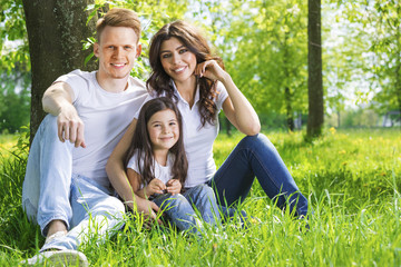 Fototapeta premium Portrait of happy family in park