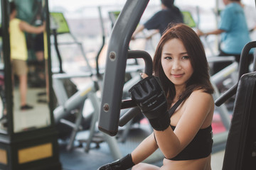 Fototapeta premium Sports women exercises at the gym.