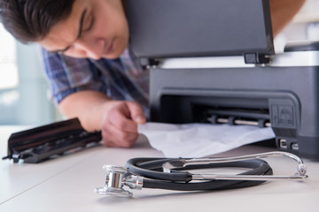 Repairman repairing broken color printer