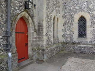 Fototapeta na wymiar A Red Door Built Into Arundel Castle in England.