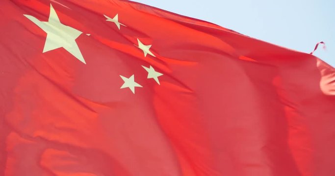 4k Chinese flag flutters in wind.