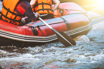 Young person rafting on the river, extreme and fun sport at tourist attraction