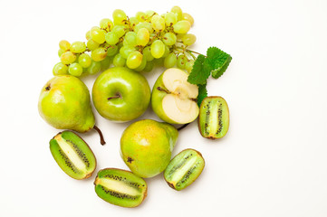 A set of green fruits, apples, grapes and kiwi. Concept of healthy eating.