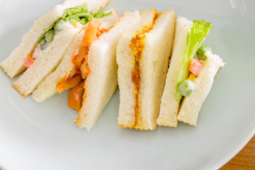 delicious sandwich with ham vegeable bread on  white dish , home made sandwich, health food