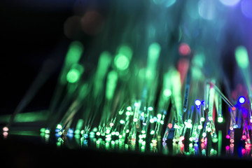 Luminous optical fiber on a black background