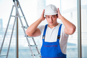 Young worker with safety helmet hardhat