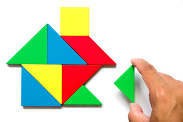 Colorful tangram puzzle in home shape wait for fulfillment (Concept for complete or dream life)