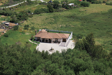 Country house surrounded by greenery