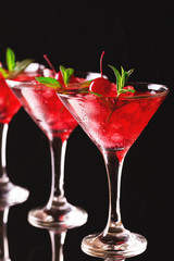 Strawberry daiquiri cocktail with lime, strawberry, cherry and mint