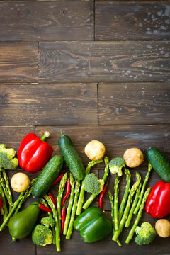 Food background. Variety vegetables. Top view of group vegan product - pepper, avocado, broccoli, cucumber, lime,potato,asparagus,tomato. Healthy eating concept. Copy space