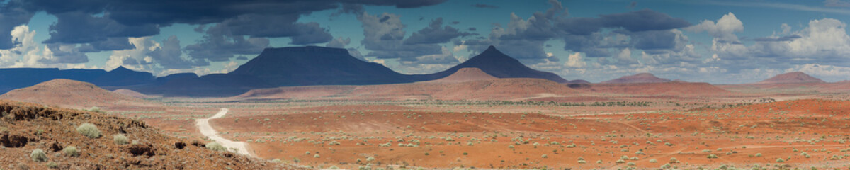 Gravel road at Damaraland with Grootberg mountains in the distance