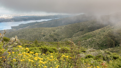 Fog Rolling In On Crystal Springs Reservoir. Sweeney Ridge, San Mateo County, California, USA.