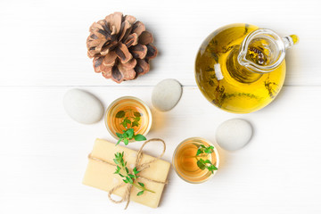 Fototapeta na wymiar Massage or aromatherapy set: oil, stones and soap