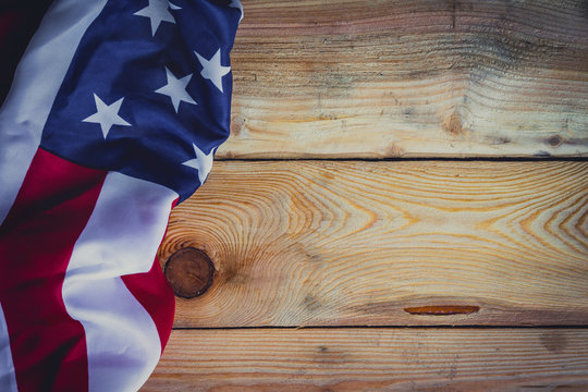 American flag on wooden background with copy space.