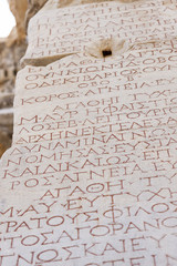 Greek writes on the marble stones of the library of Celsus in Ephesus - Turkey