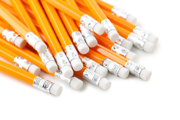 Yellow pencils with erasers on a white background