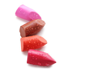 Colorful lipsticks on a white background