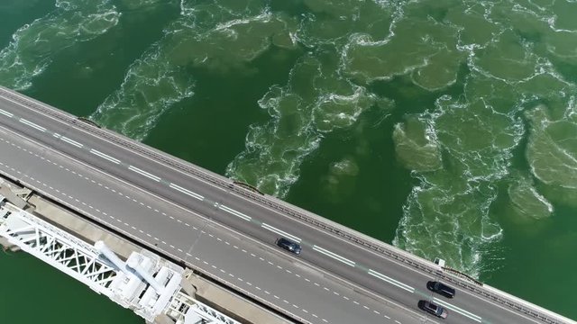 Aerial camera panning down over Oosterscheldekering is largest of the 13 ambitious Delta Works series of dams and storm surge barriers designed to protect the Netherlands from flooding from North Sea