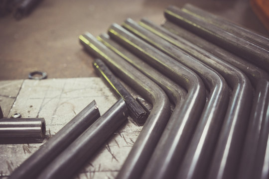 Steel Pipe On A Work Bench.