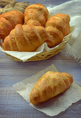 Fresh croissants . Breakfast. / Toned in retro style /