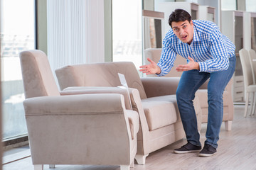 Young man shopping in furniture store