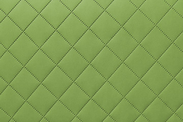 detail of green sewn leather, green leather upholstery background pattern