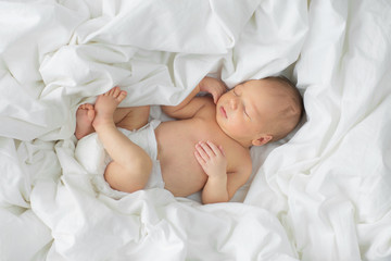 Newborn baby sleeping on a blanket. Age 1 week - 159212185