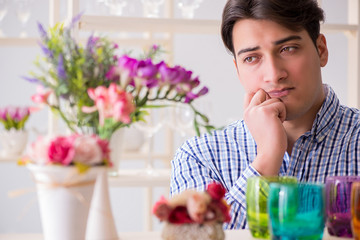 Young handsome man shopping in shop
