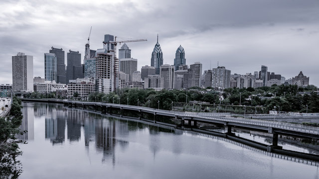 Philadelphia skyline with a blue tint with river