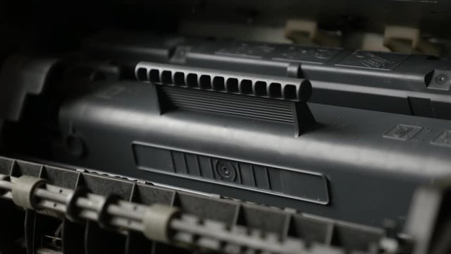 Toner cartridge replacement inside office printing device 4K 2160p 30fps UltraHD footage - Repairman changes modern laser printer cassette 3840X2160 UHD video
